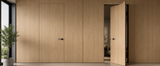 Modern interior with concealed aluminum-framed doors demonstrating a clean, flush architectural door system.
